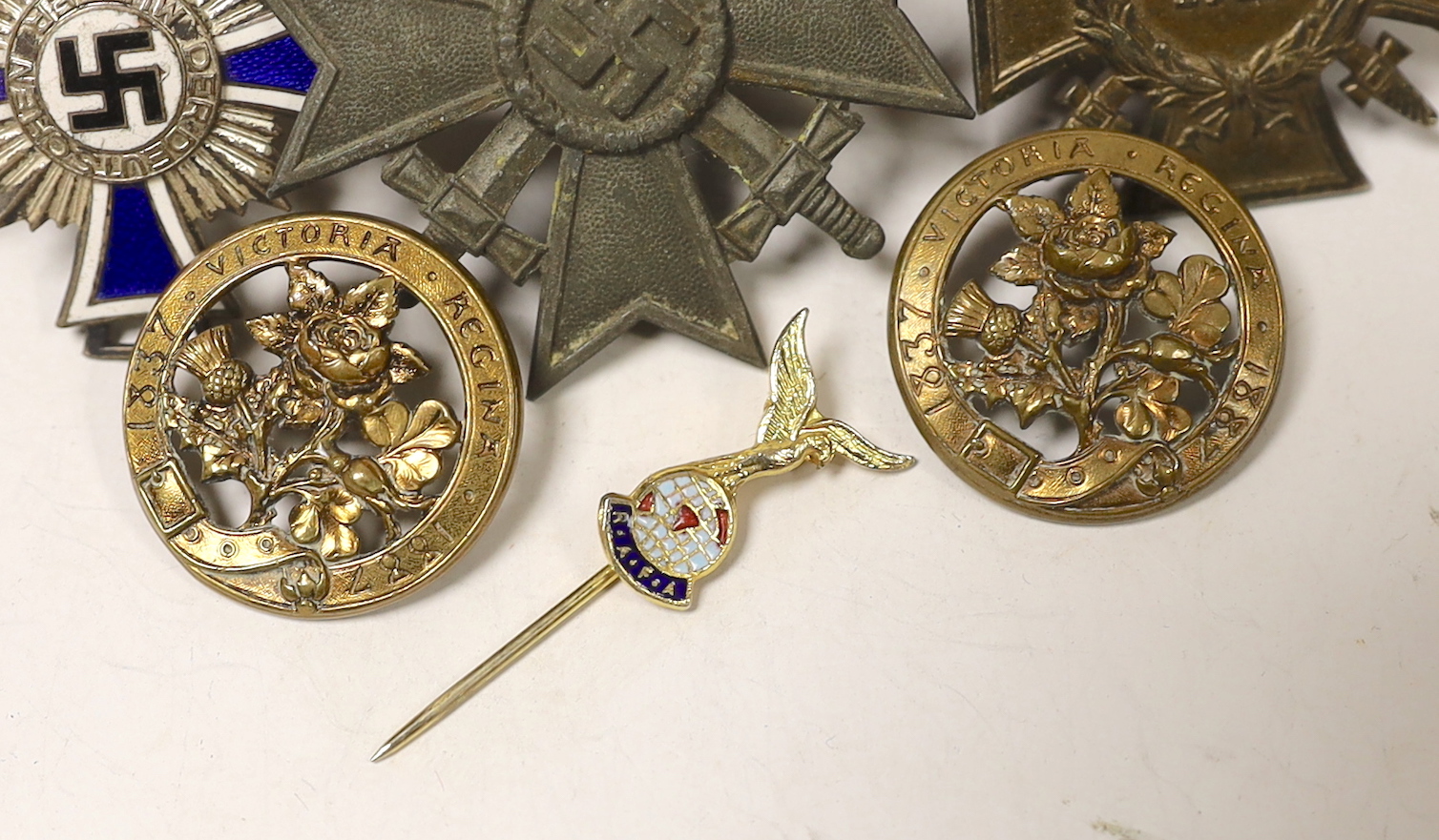 A WW1 Hindenburg Honour Cross A WW2 Silver German Mothers Cross showing some damage (for producing 6 or more children), a WW2 bronze Military War Merit Cross (with Swords) a small RAFA lapel badge, two gilt? badges comme